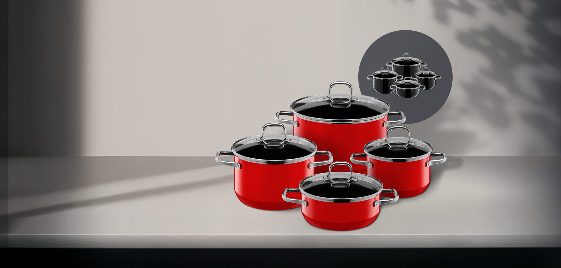 Silit Silargan Passion cookware set in red on a calm kitchen counter